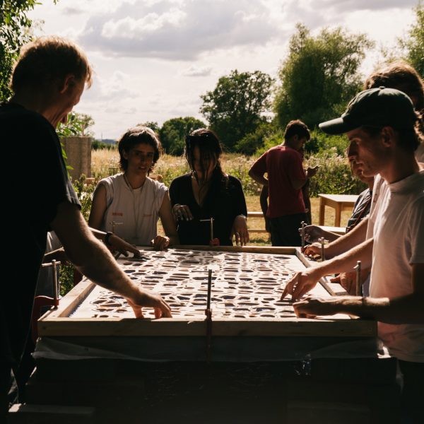 Photo of people stood around a table