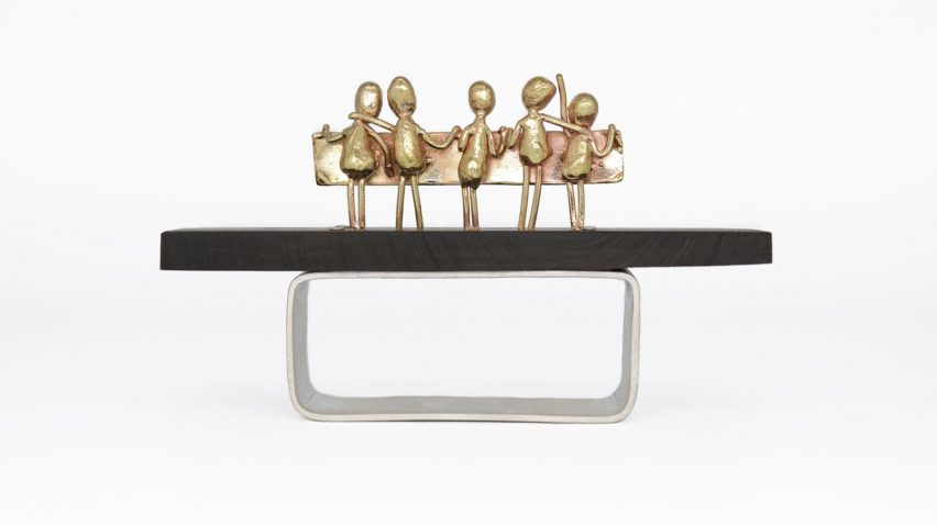 Photo of a gold and silver-toned metal design object
