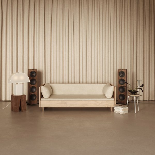 Photo of a sofa, lamp and speakers
