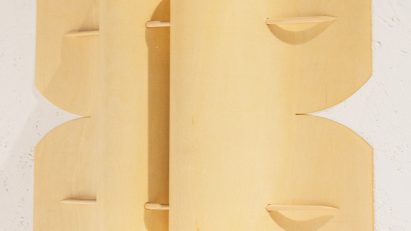 Folded timber lamp by Anton Mikkonen resembles “a butterfly pinned to the wall”