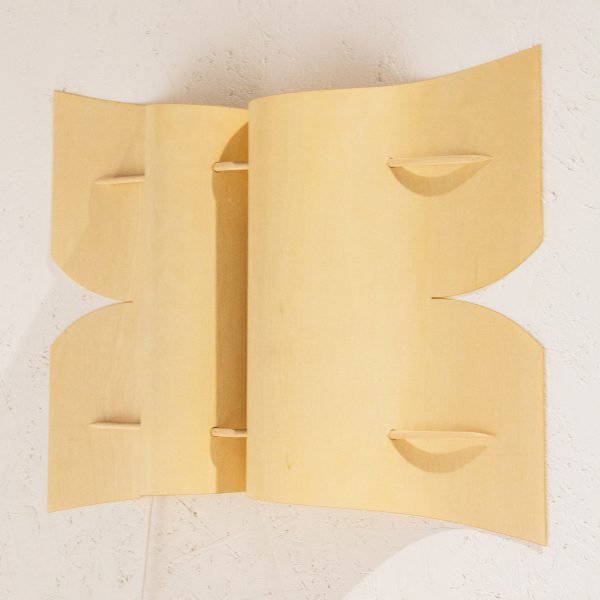 Folded timber lamp by Anton Mikkonen resembles “a butterfly pinned to the wall”