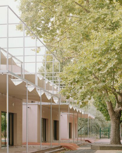 Metal canopies line nursery by Archikon