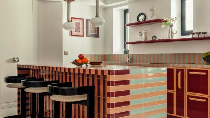 Kitchen with striped, tiled island and counters