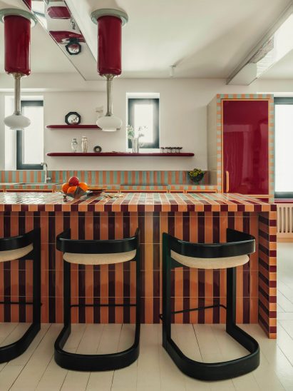 Kitchen with striped, tiled island and counters