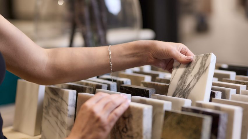a photograph of a person holding tiles