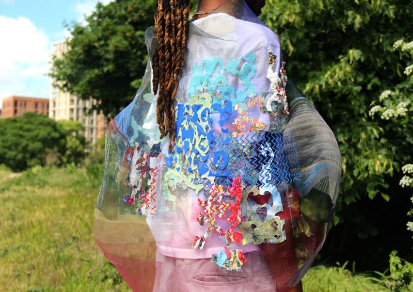 a photograph of a person wearing garments in tones of pink, blue, red and green