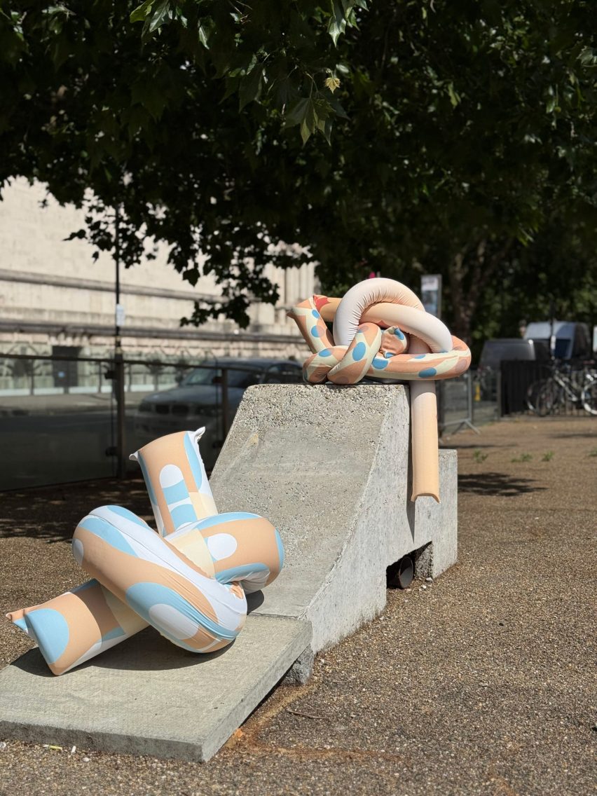 a photograph of sculptures displayed in the street