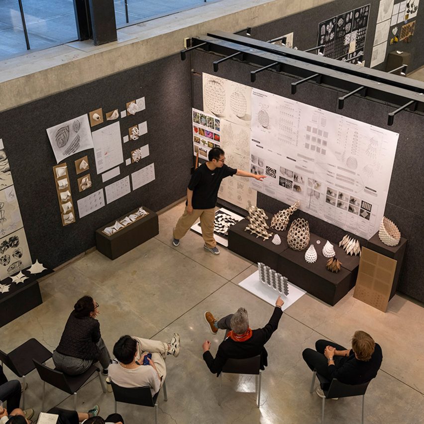 a photograph of people viewing an exhibition