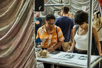 a photograph of people at an exhibition