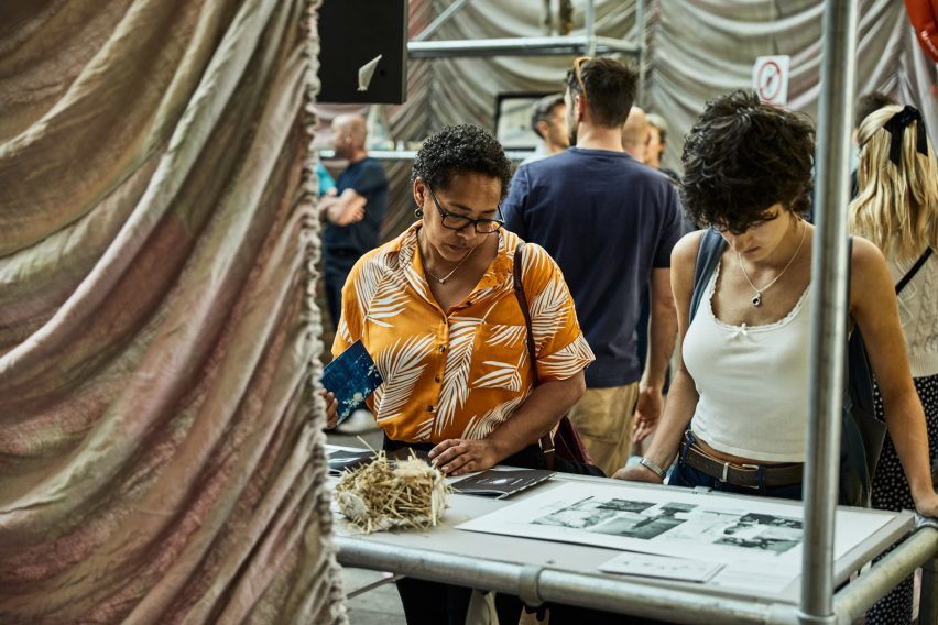 a photograph of people at an exhibition