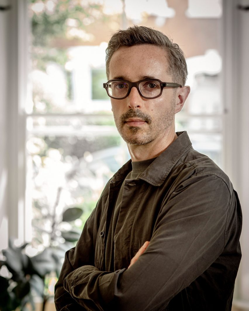 a photograph of a person in a brown shirt