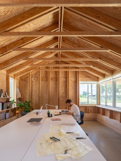 Architect's studio with a pitched ceiling and exposed timber framing