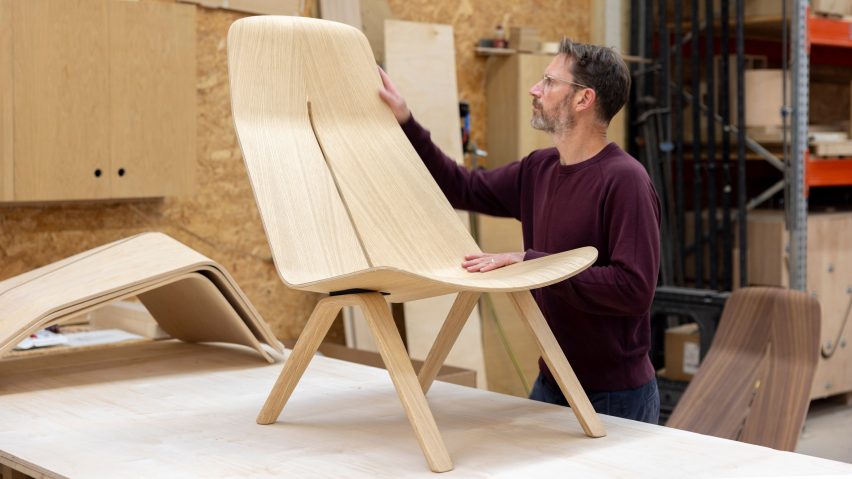 Man with plywood chair