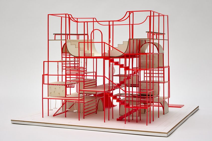 a photograph of an architectural model in tones of red