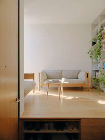 Living room with wooden floors and shoe storage