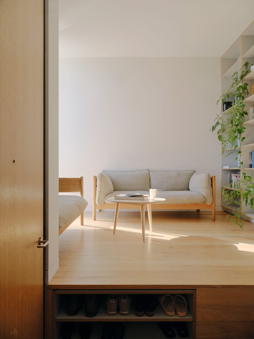 Living room with wooden floors and shoe storage