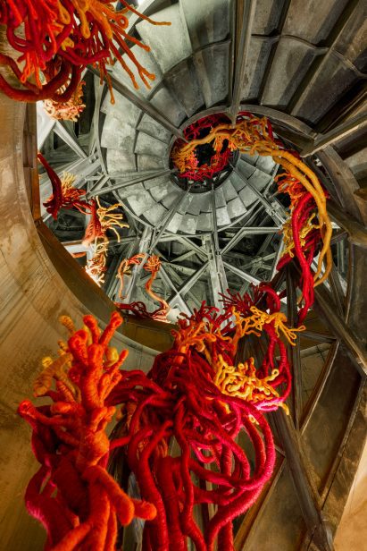 Corals of Liberty installation by Aude Franjou spilling down a staircase in paris's July column