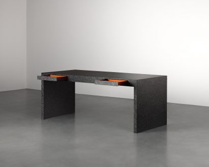 Desk with a flecked surface finish