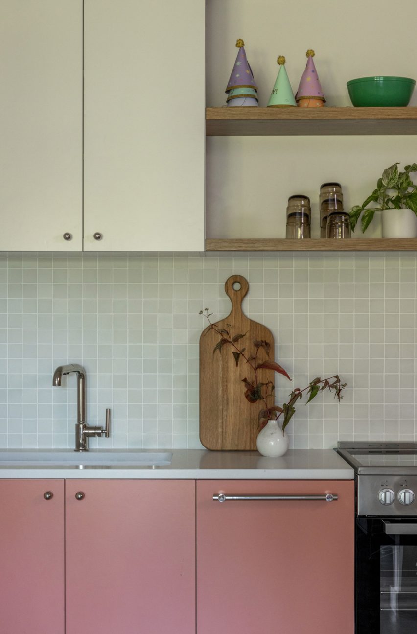 Kitchen with pink cabinets