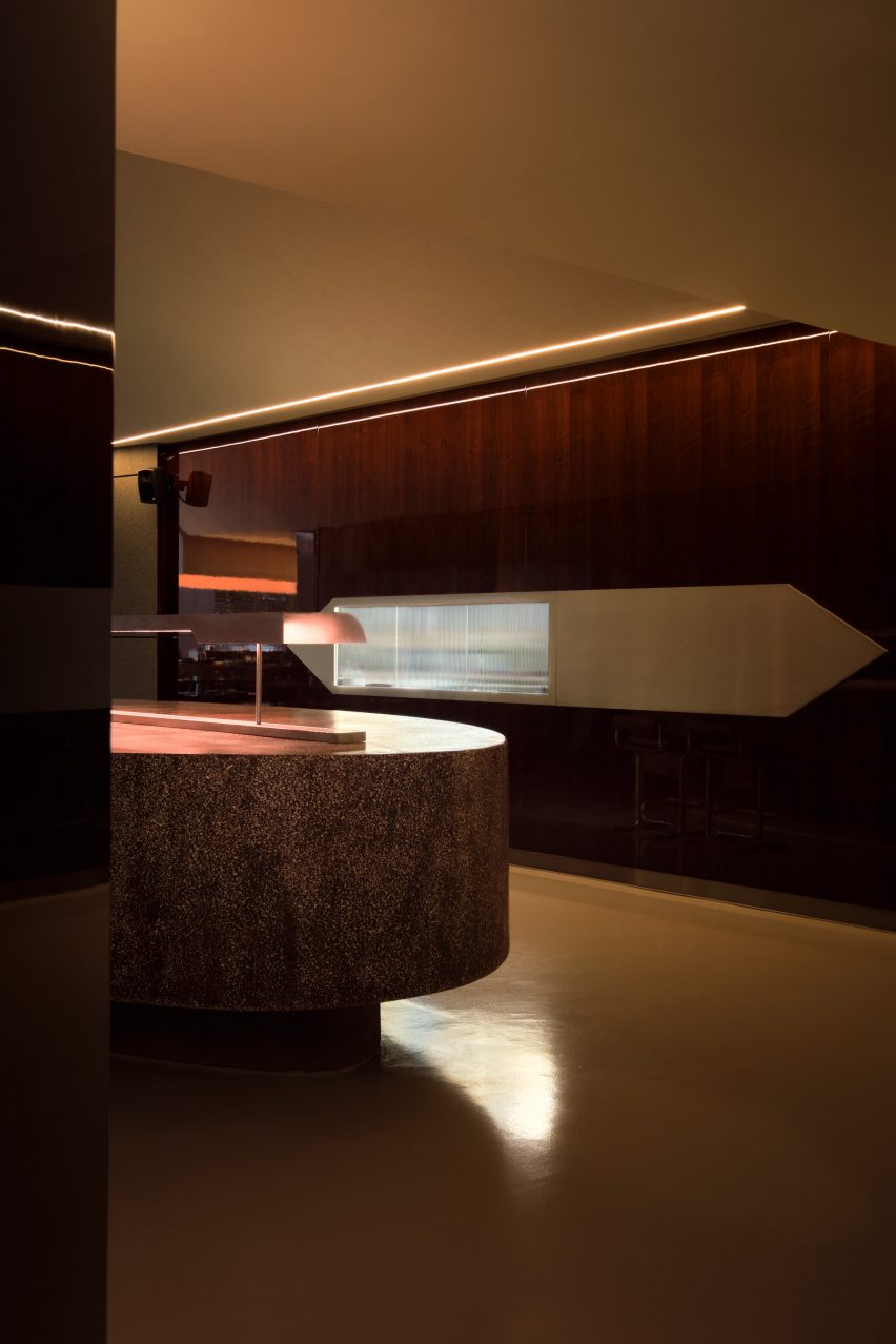 Stainless steel and textured glass wall cut-out