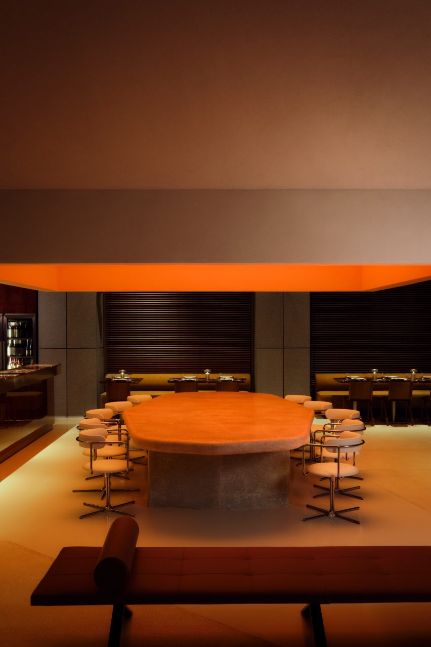 Sculptural ceiling feature with warm orange light