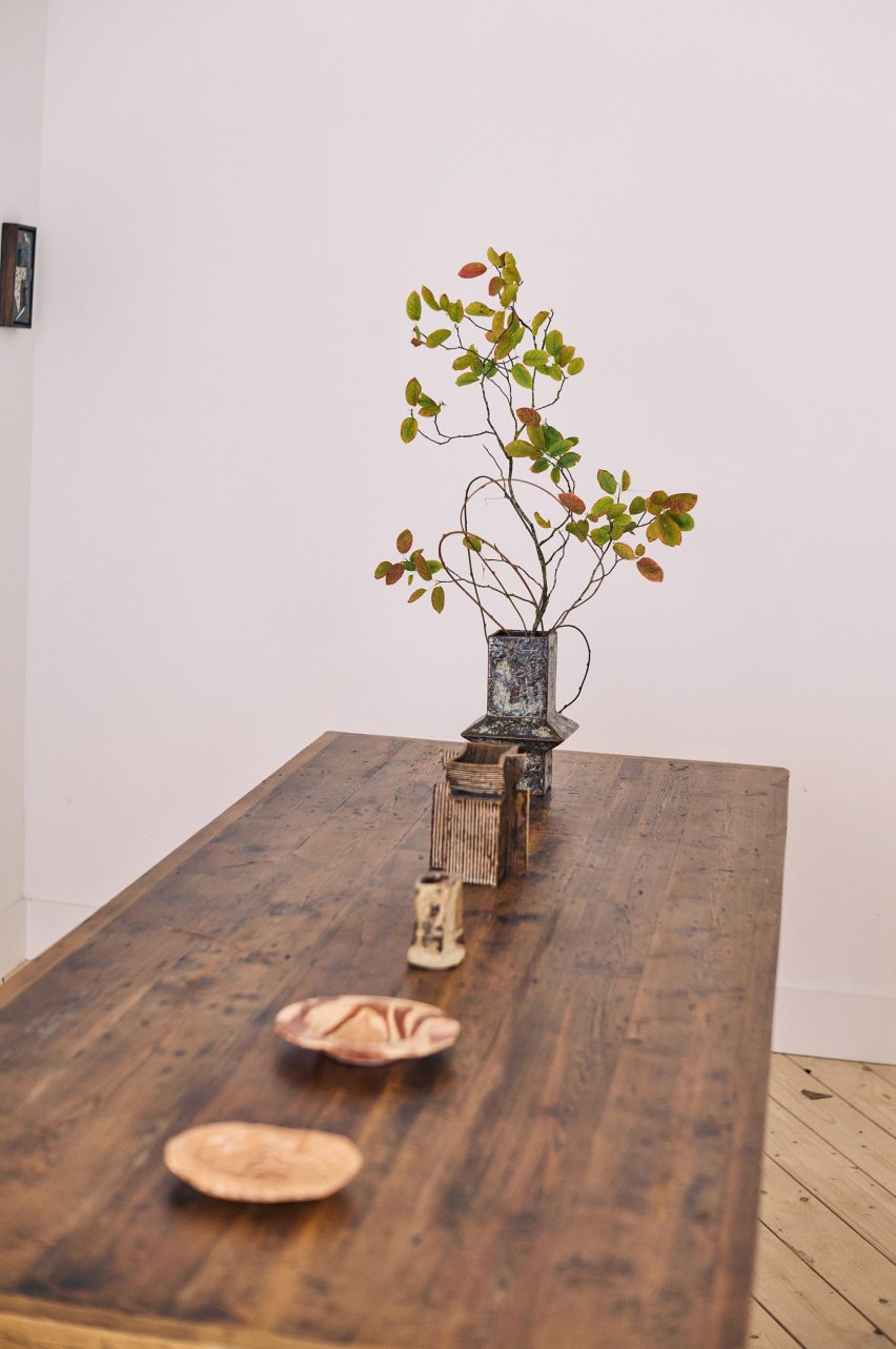 Ceramic plates and vases on table in Mirroring Dialogue exhibition in Brompton Design District for London Design Festival 2025