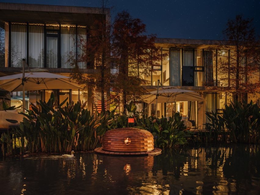 Lit-up duck shelter in villa pond