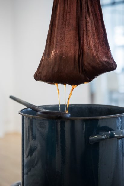 Wool being dyed in a pot