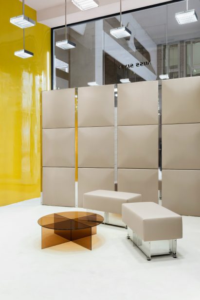 Bright yellow wall in fashion store
