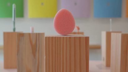 Pink sponge on wooden plinth