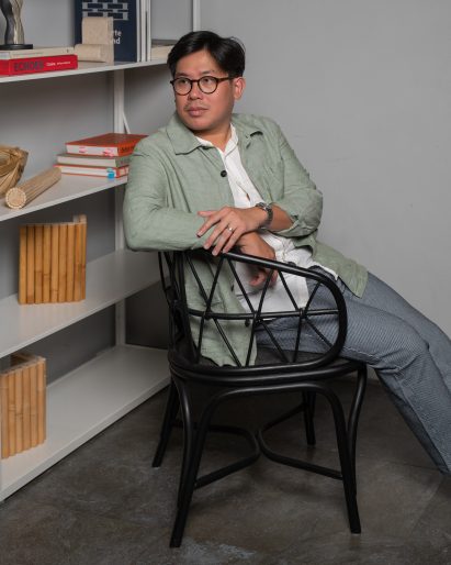 Felix Sidharta of Cassia sitting on Simpul rattan chair