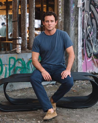 Pietro Franceschini sitting on Rotella rattan bench