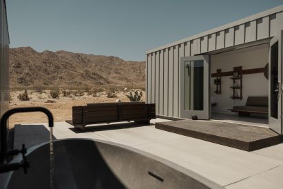 Shipping container hotel room with a patio onto the desert
