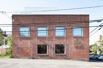 Exterior of a two-storey brick building with square windows