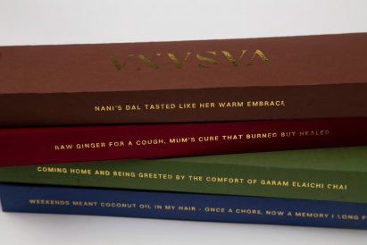 a photograph of a stack of books in tones of brown, red, green and blue