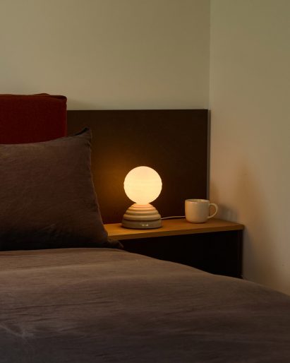 Wake/Sleep light by Heatherwick Studio for Tala in a darkened bedroom