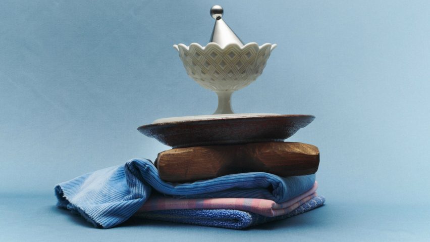 A curated display of objects against a blue backdrop