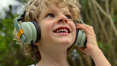 Little boy wearing the Kibu headphones