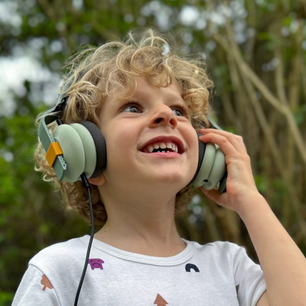 Little boy wearing the Kibu headphones