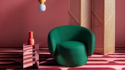 Newstalgia flooring, featuring pink and red carpet and emerald-coloured chair
