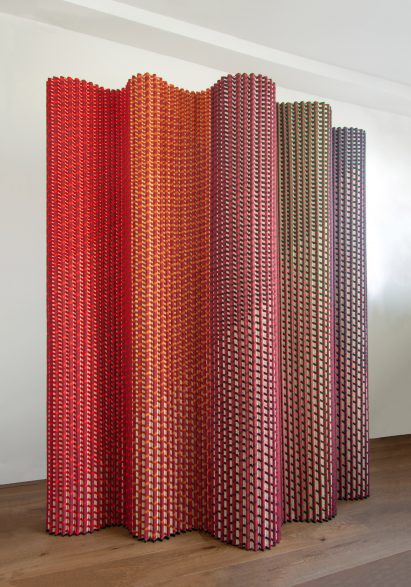 Plissade in red, orange and green hues