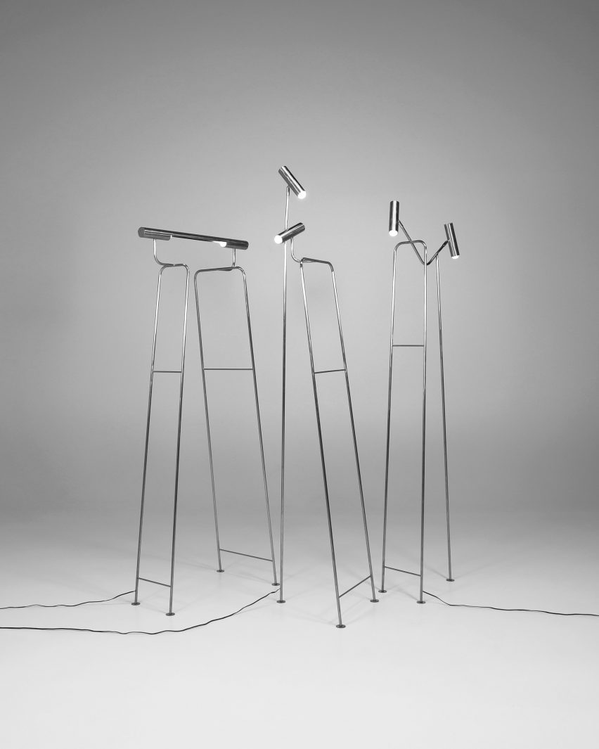 a photograph of silver floor lamps