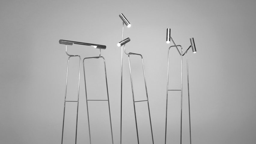 a photograph of silver floor lamps