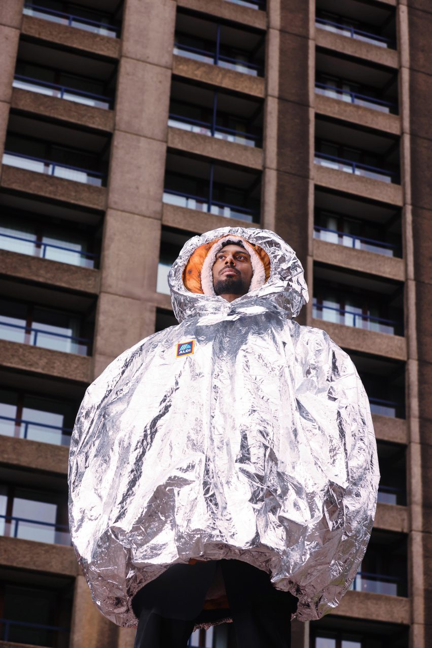 a photograph of a person wearing a silver coat