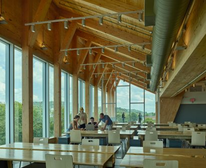 Classrooms in a mass-timber university building by Grafton Architects
