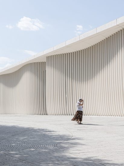 Person walking past the Tselinny Center of Contemporary Culture in Kazakhstan