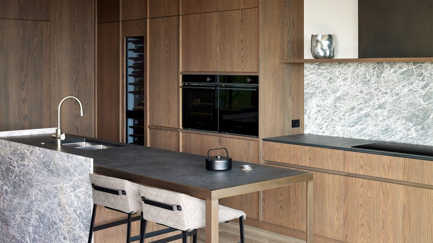 Oak and marble kitchen in an apartment by Monk Mackenzie