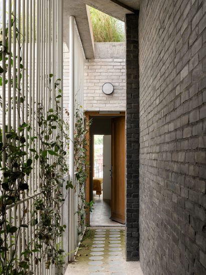 Corridor to apartment at London mixed-use block Cuozzo.Company