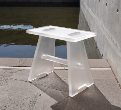 a photograph of a stool made from white, transparent materials