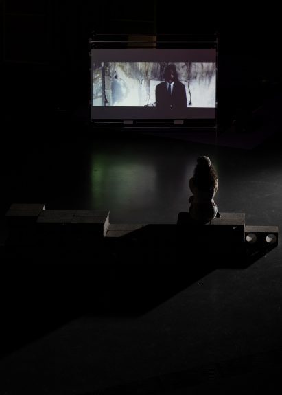 a photograph of a person viewing a screen
